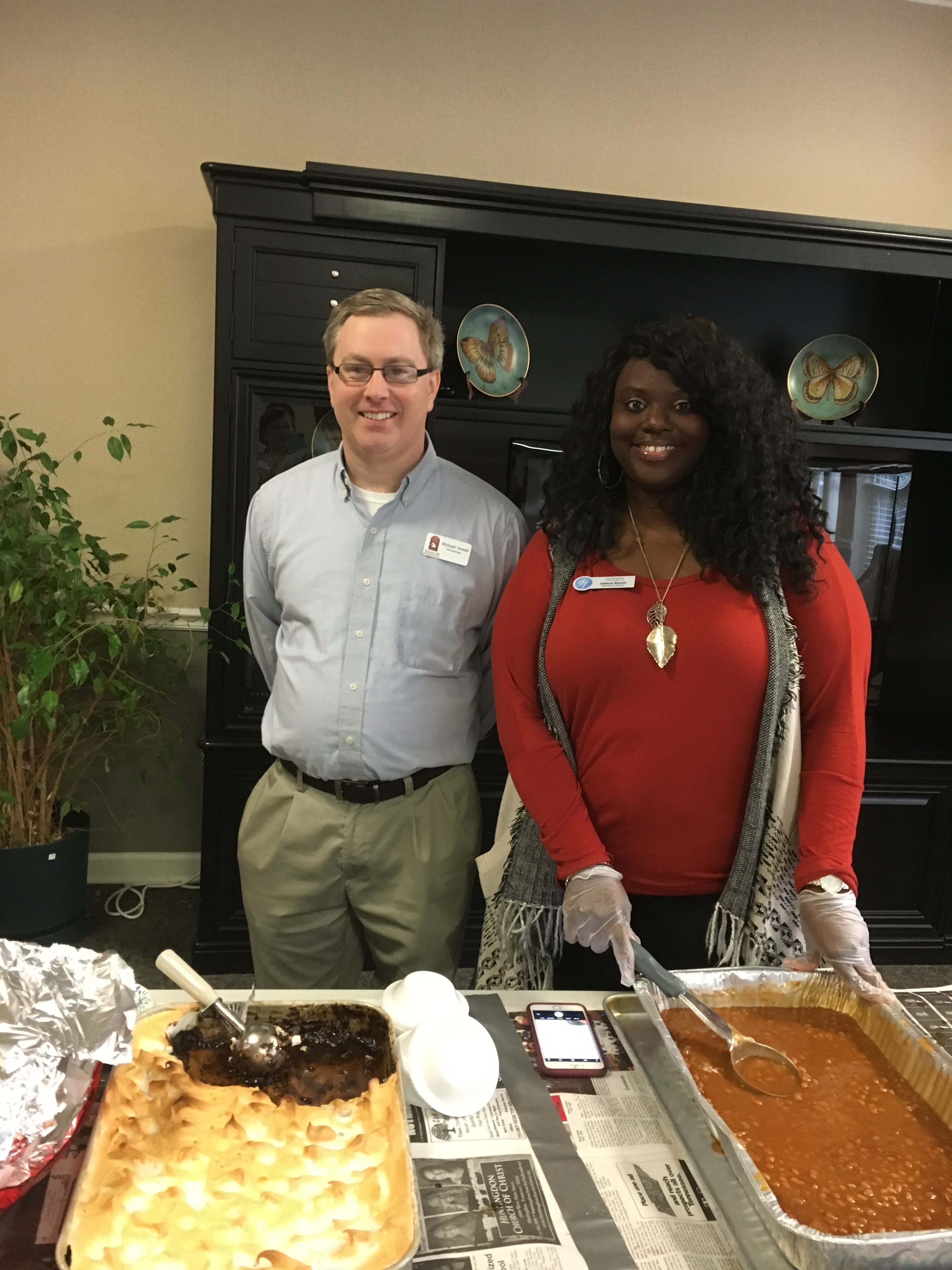 Jaleesa, Administrator and Administrator Michael Vowell serving food for community