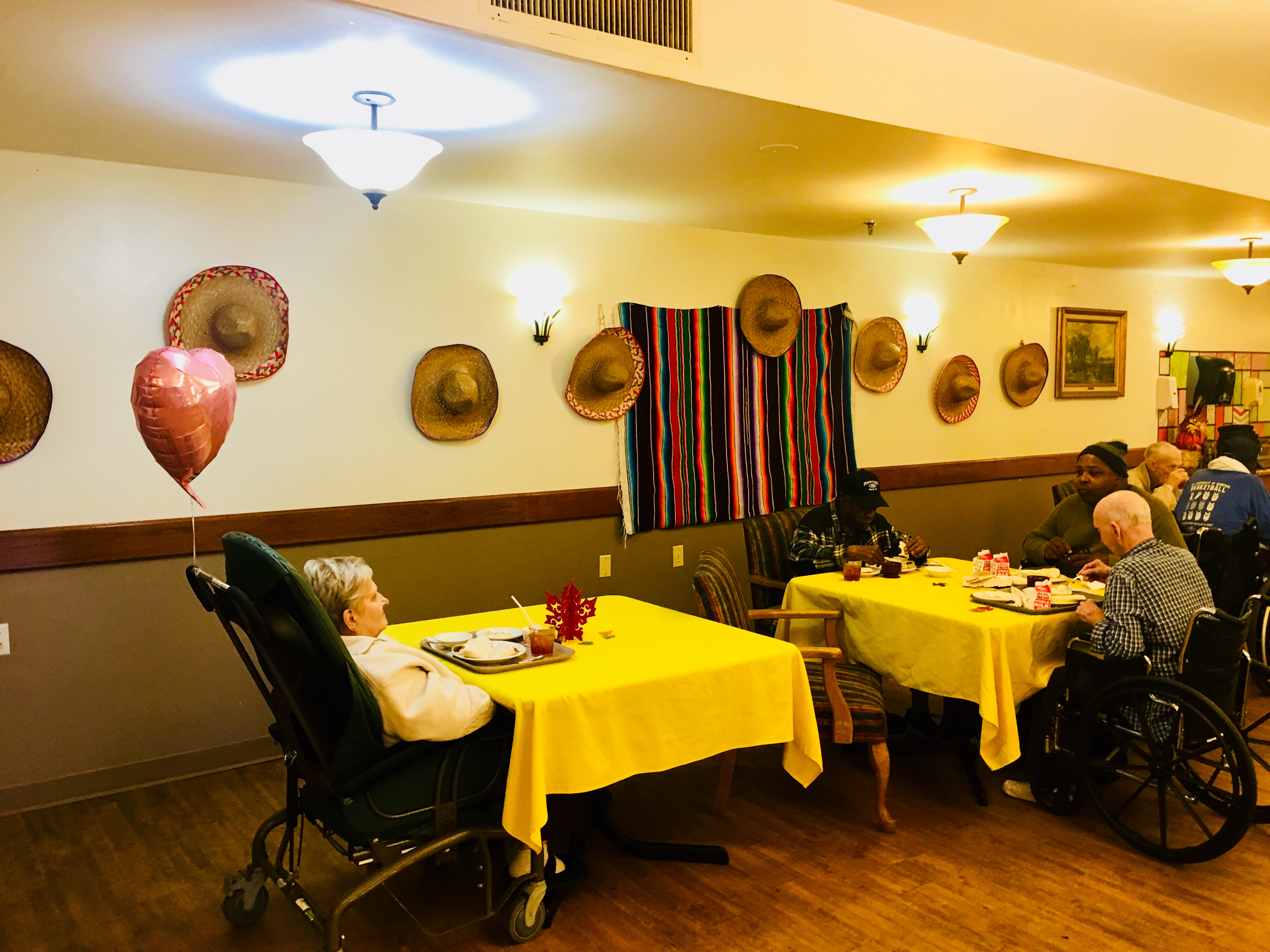 residents and family with mexican themed dining room